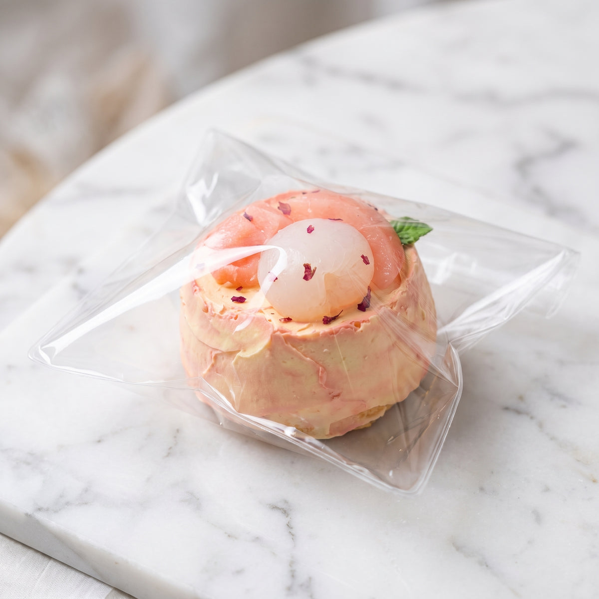 Peach lychee cake TABA squishy with buttercream texture and fruity layered finish, handmade moderate rising stress relief squishy Australia Sydney