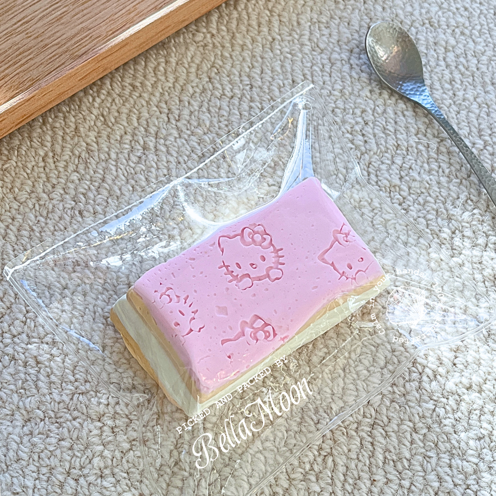 Hello Kitty Soft Cheesecake squishy with layered cream texture, kawaii dessert stress relief toy
