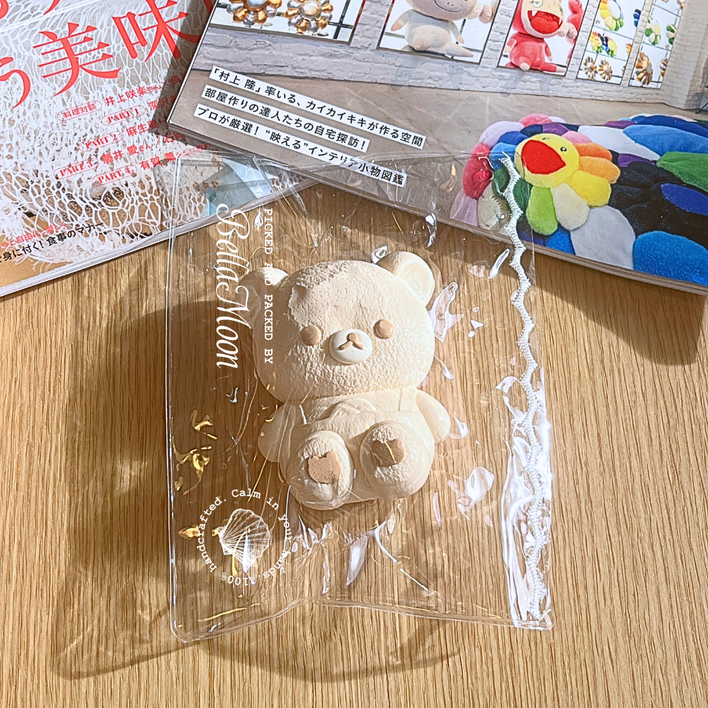 Bibbed Rilakkuma TABA squishy with dry yoghurt texture and tiny bib detail, handmade slow rising stress relief squishy Australia Sydney