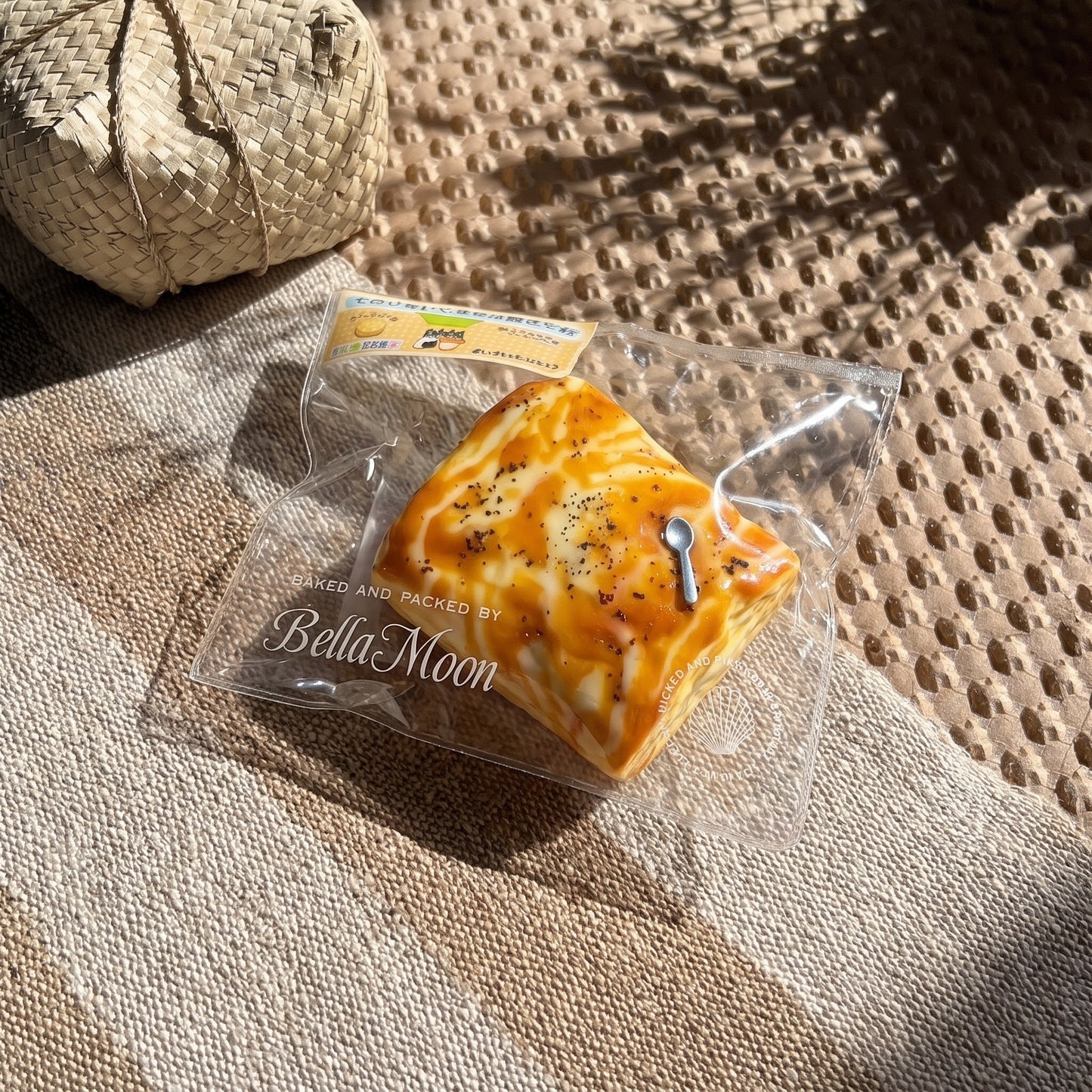 Golden brown charcoal-grilled marshmallow TABA squishy with honey cheese swirl and toasted char flecks, handmade slow rising stress relief squishy Australia Sydney