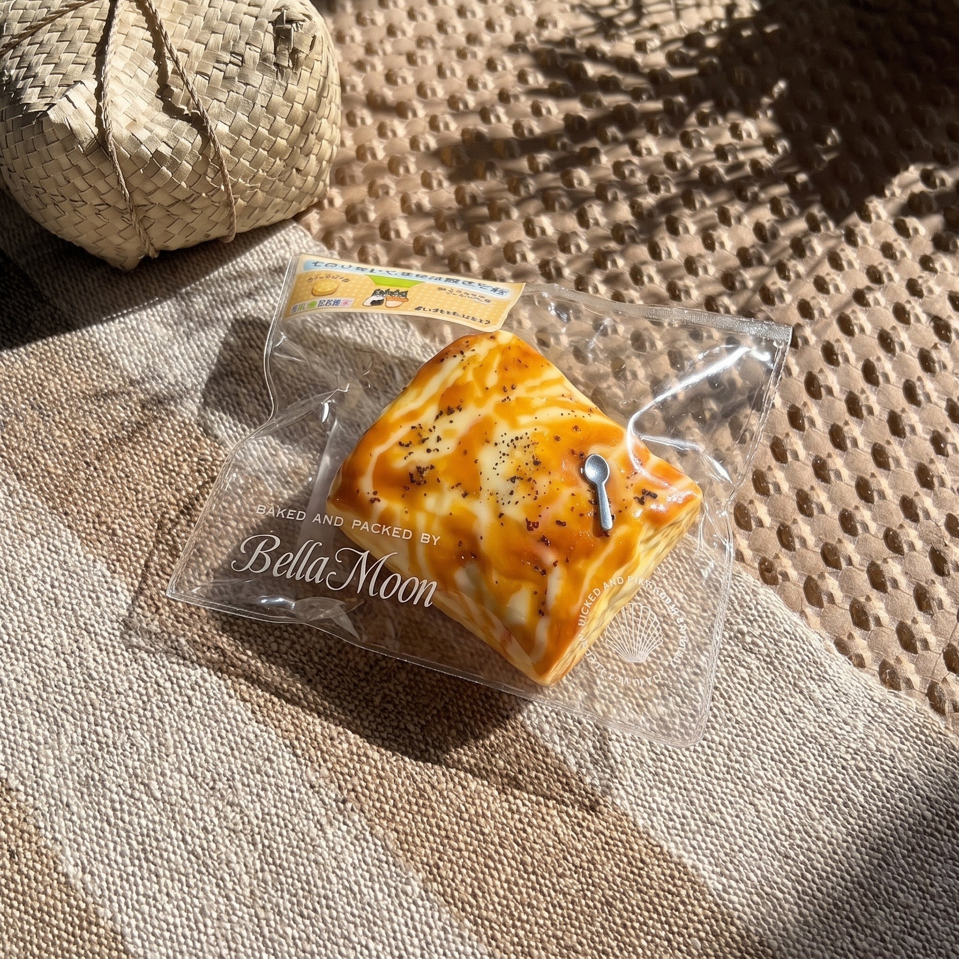 Golden brown charcoal-grilled marshmallow TABA squishy with honey cheese swirl and toasted char flecks, handmade slow rising stress relief squishy Australia Sydney