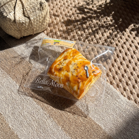 Golden brown charcoal-grilled marshmallow TABA squishy with honey cheese swirl and toasted char flecks, handmade slow rising stress relief squishy Australia Sydney