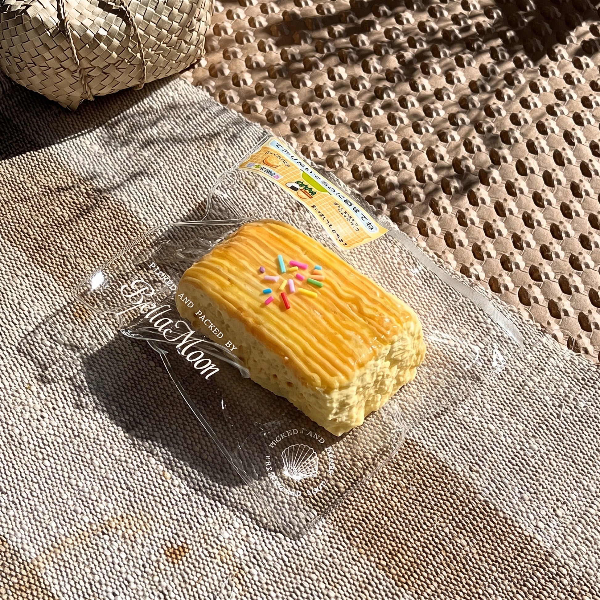 Golden ridged cheese stripe vintage cake TABA squishy with rainbow sprinkle topping, handmade slow rising stress relief squishy Australia Sydney