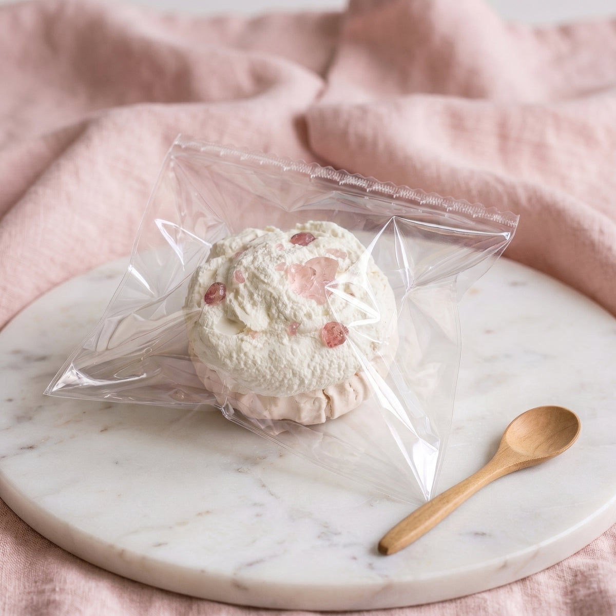 Pomegranate cupcake TABA squishy with whipped cream texture and jewel-toned fruit topping, handmade fast rising stress relief squishy Australia Sydney