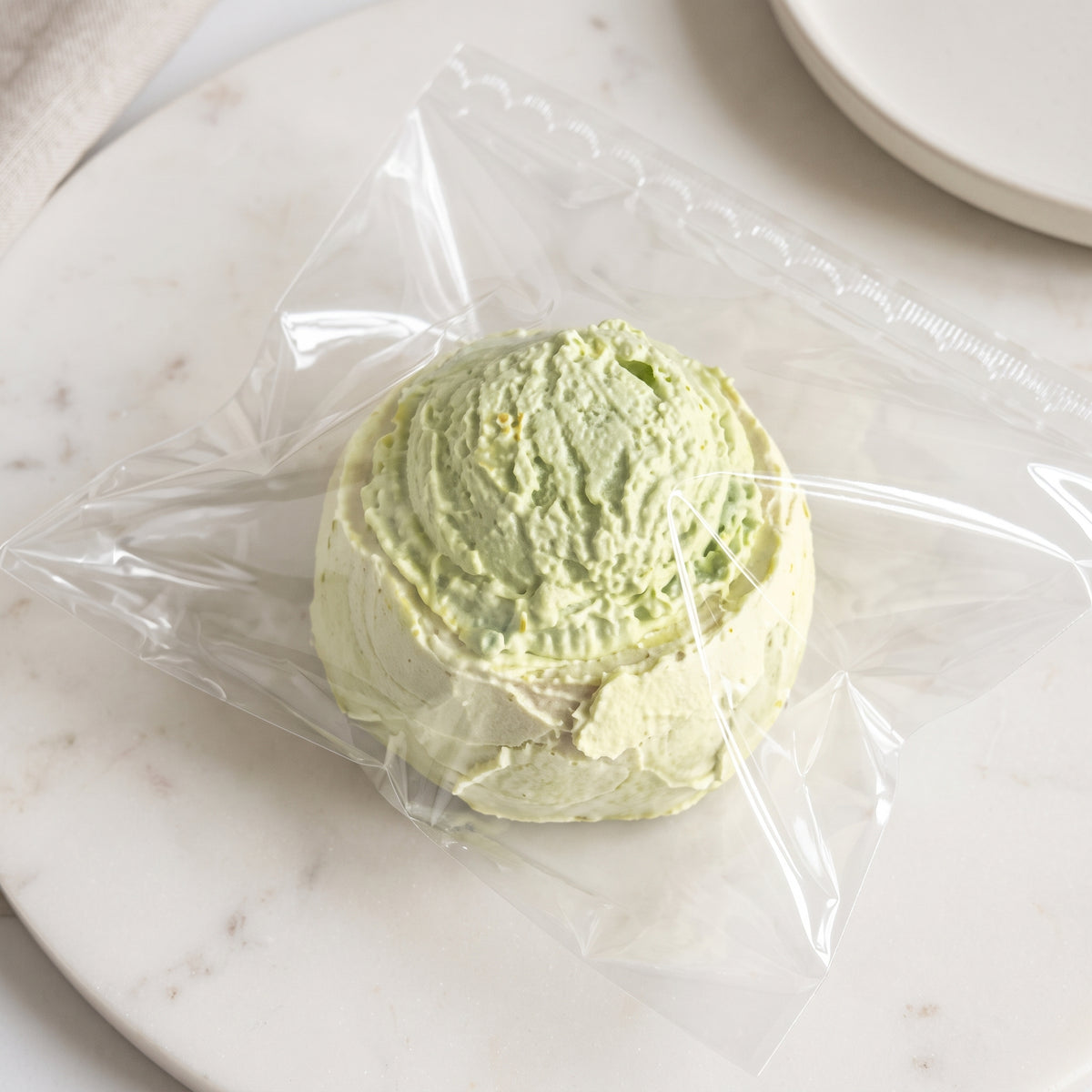 Rock melon ice-cream cake TABA squishy with whipped cream texture and orange melon swirl, handmade extra slow rising stress relief squishy Australia Sydney