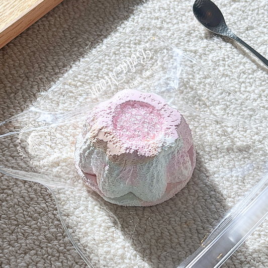 Soft pink blushing strawberry puff pudding squishy with whipped cream texture, 195g weight and moderate bounce rate for anxiety management