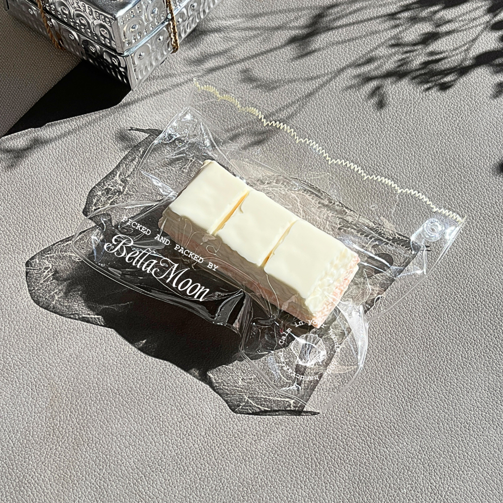 Compact milky white peach chocolate bar squishy with extra-slow rise for pocket-sized comfort and portable stress relief