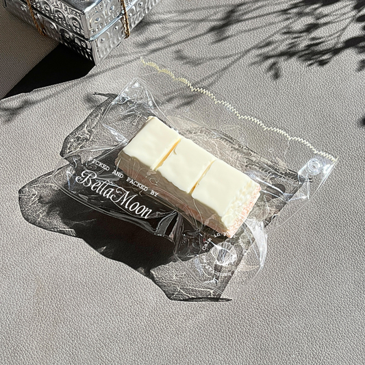 Compact milky white peach chocolate bar squishy with extra-slow rise for pocket-sized comfort and portable stress relief