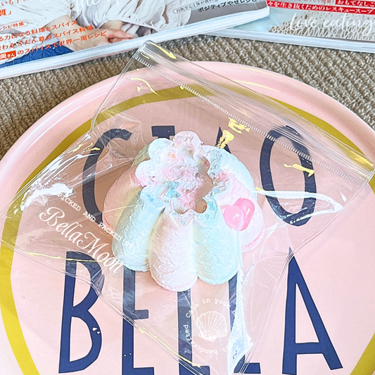 Colorful cotton candy pudding shaped squishy with Greek yogurt texture, 195g weight providing consistent tactile feedback for autism sensory processing support