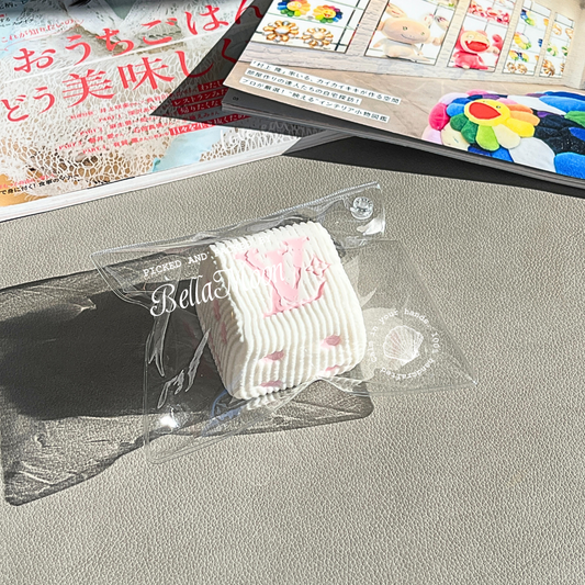 LV Dice Milk Curd Squishy with luxury dice design and pillowy texture, premium collectible Australian stress relief toy for sophisticated users