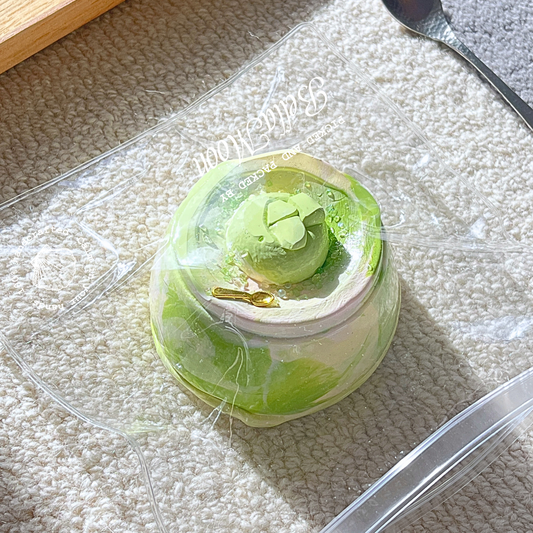 Calming green matcha cream pudding shaped squishy with soft butter texture, 269g weight designed for autism spectrum sensory regulation and emotional support