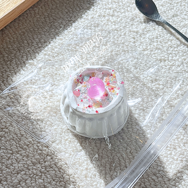 Milky white party mini pudding shaped squishy with unique dough texture, heaviest mini design at 153g weight for therapeutic tactile exploration