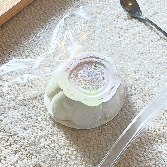 Pink yogurt silk pudding squishy toy with Greek yoghurt texture, heaviest in collection at 279g, designed for intensive sensory regulation and autism support